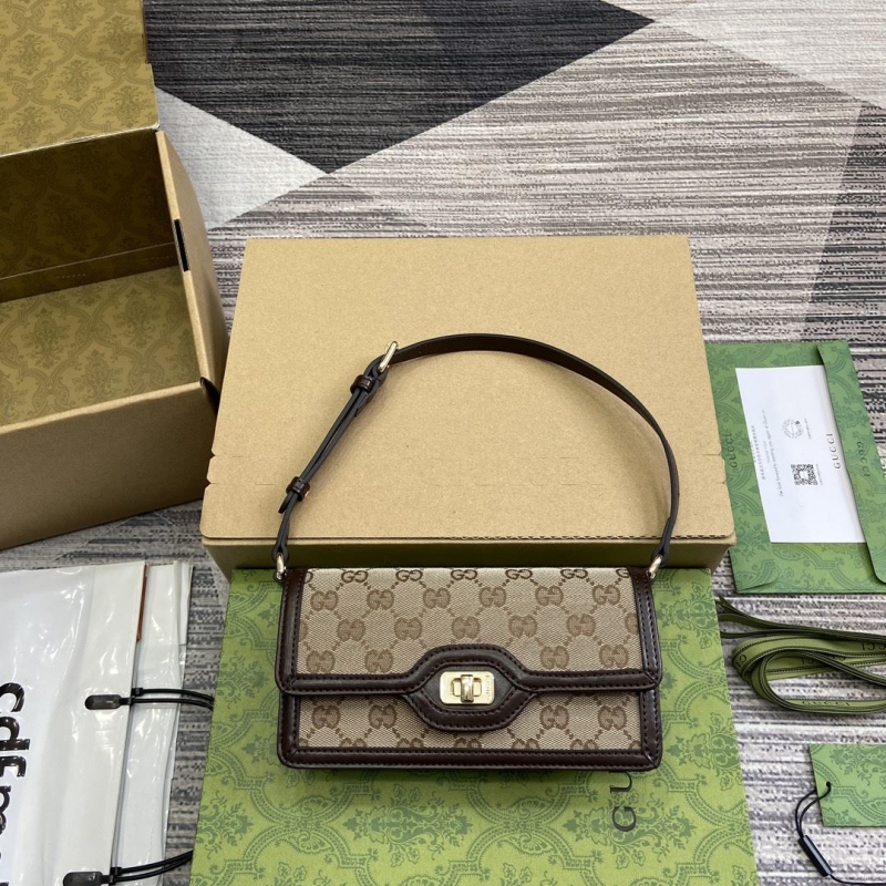G*u*i top handle bags